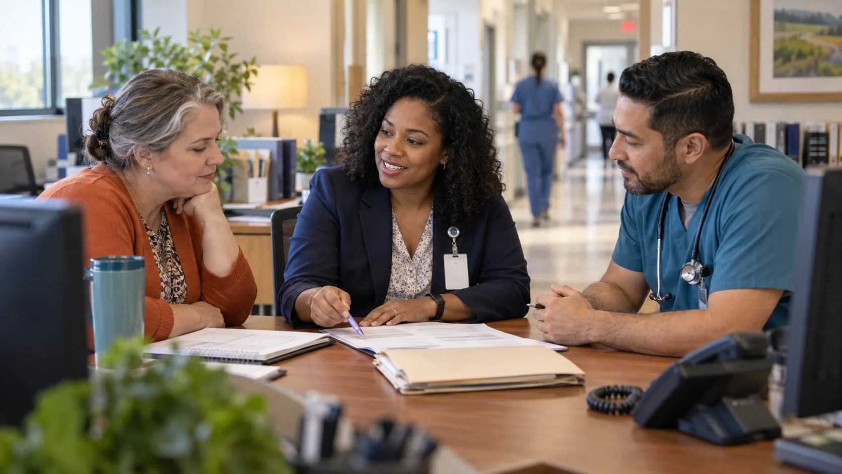 Denial-resolution specialist and clinician reviewing a claim together
