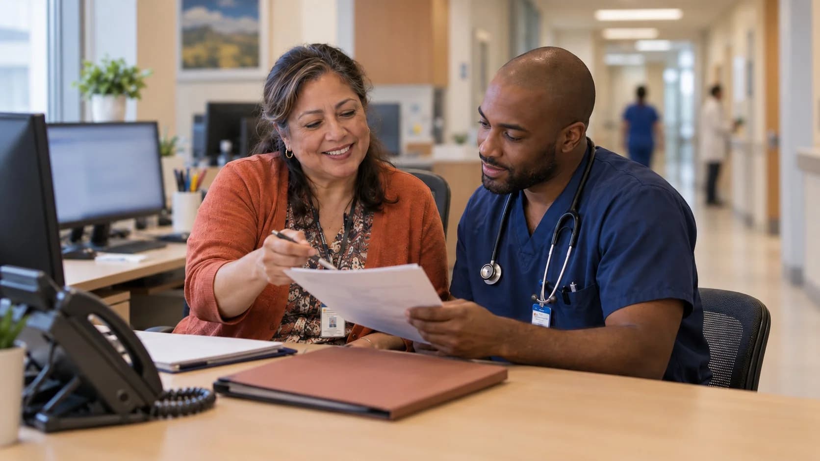 Medical coder and clinician resolving a claim detail together