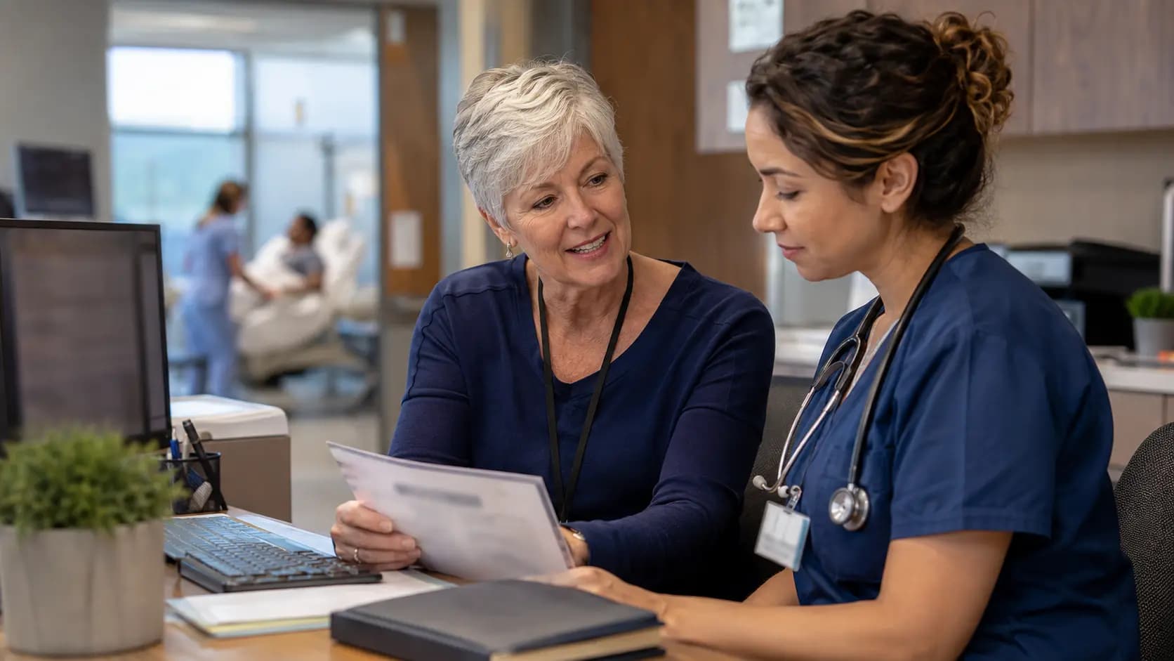 Medical coder and clinician resolving documentation together