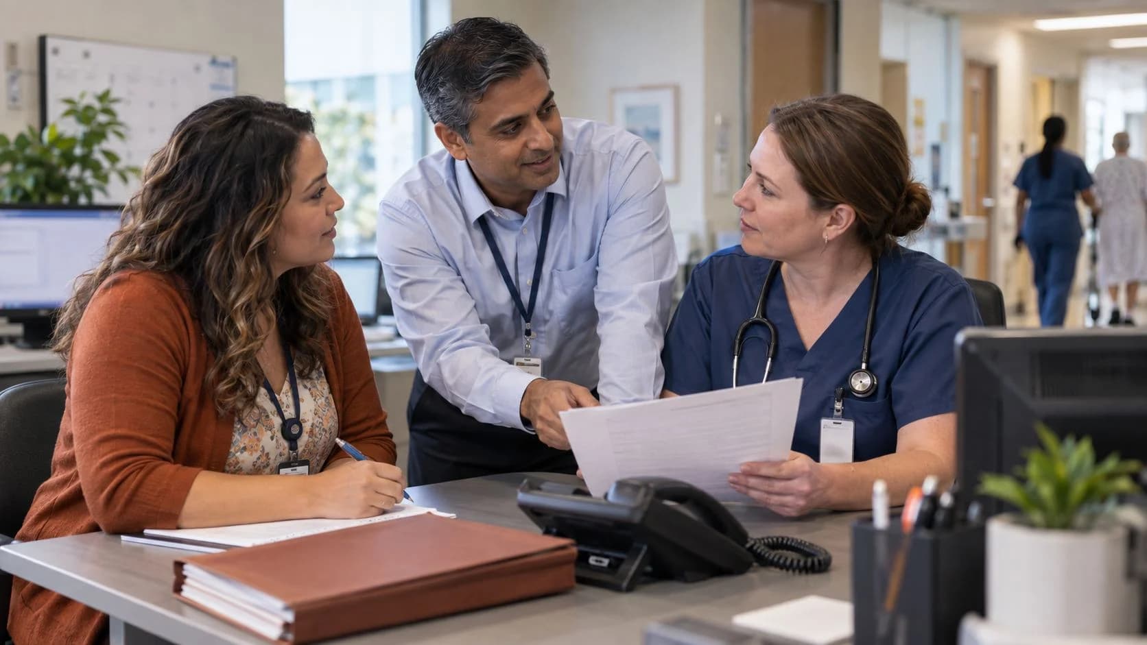Patient-access coordinator and clinician resolving an authorization issue