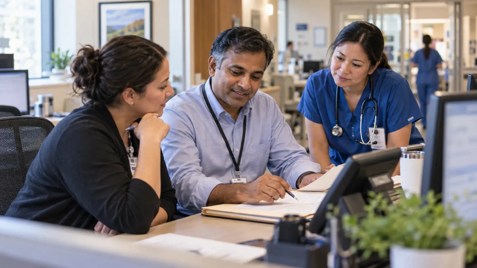 Revenue-cycle specialist and clinician resolving a billing workflow together Revenue-cycle specialist and clinician resolving a billing workflow together