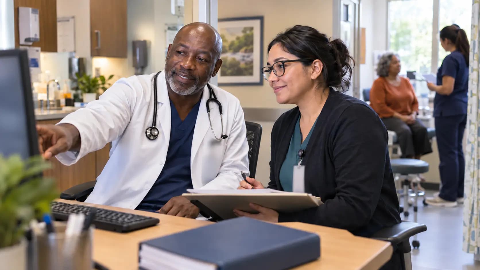 Medical coder and clinician resolving documentation together