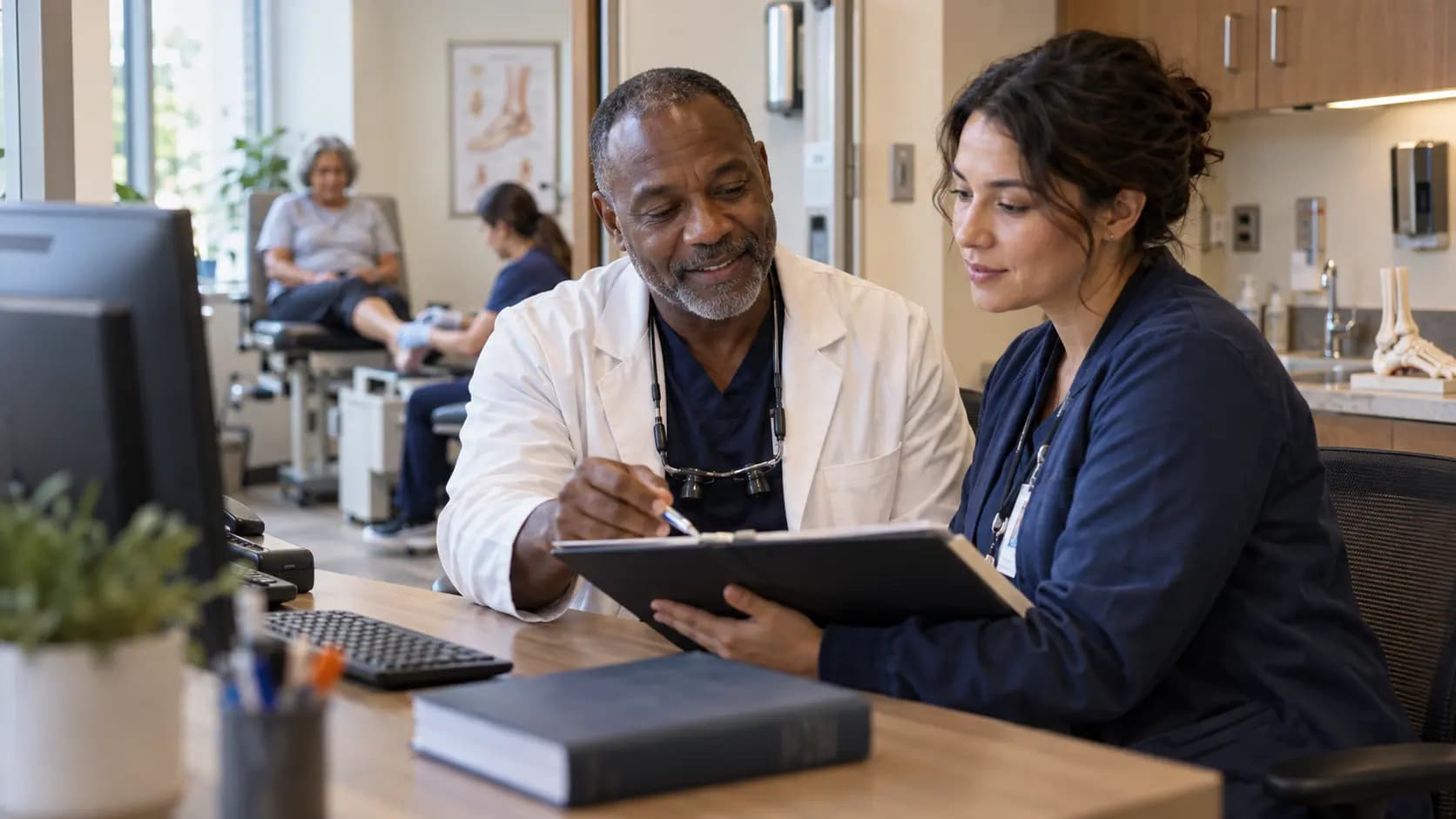 Medical coder and clinician resolving documentation together Medical coder and clinician resolving documentation together