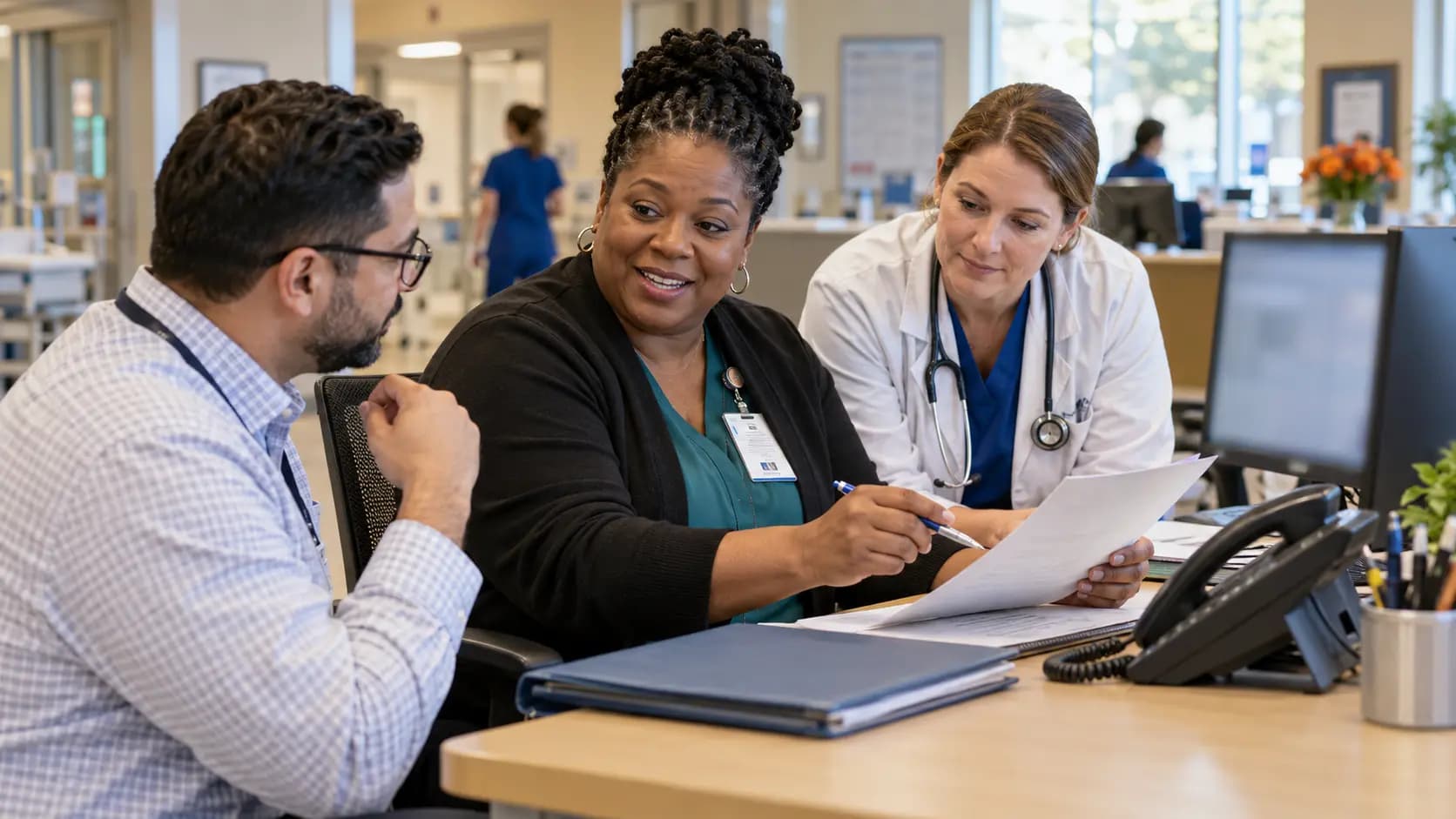 Revenue-cycle specialist and clinician resolving a billing workflow together Revenue-cycle specialist and clinician resolving a billing workflow together