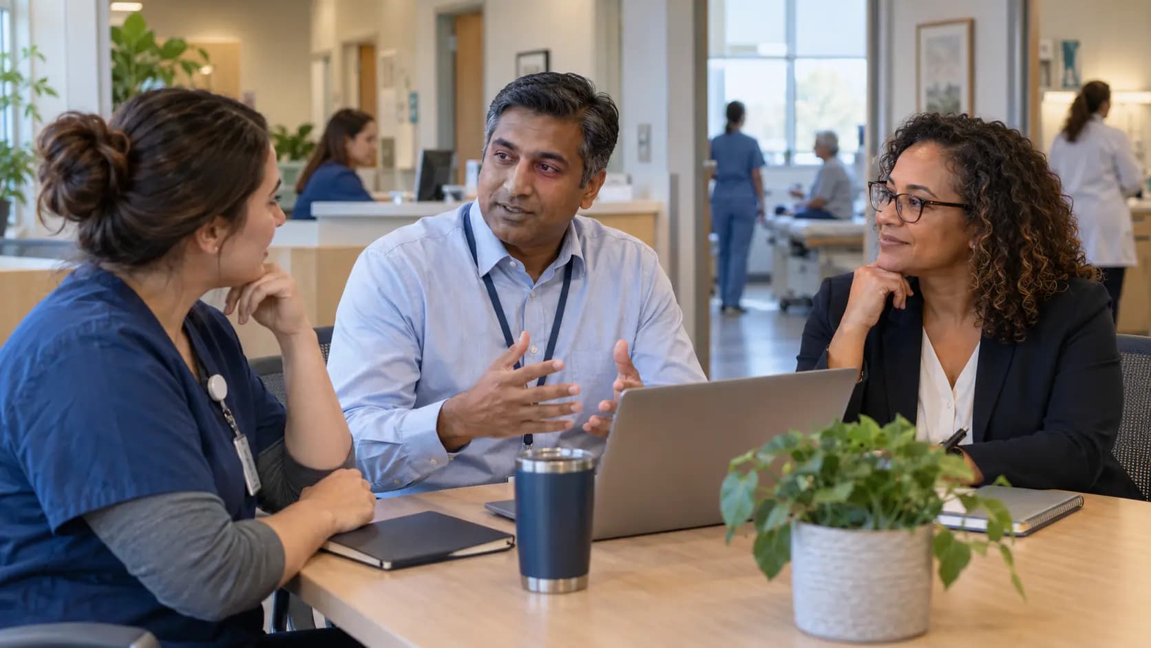 Healthcare operations and compliance colleagues collaborating in an office
