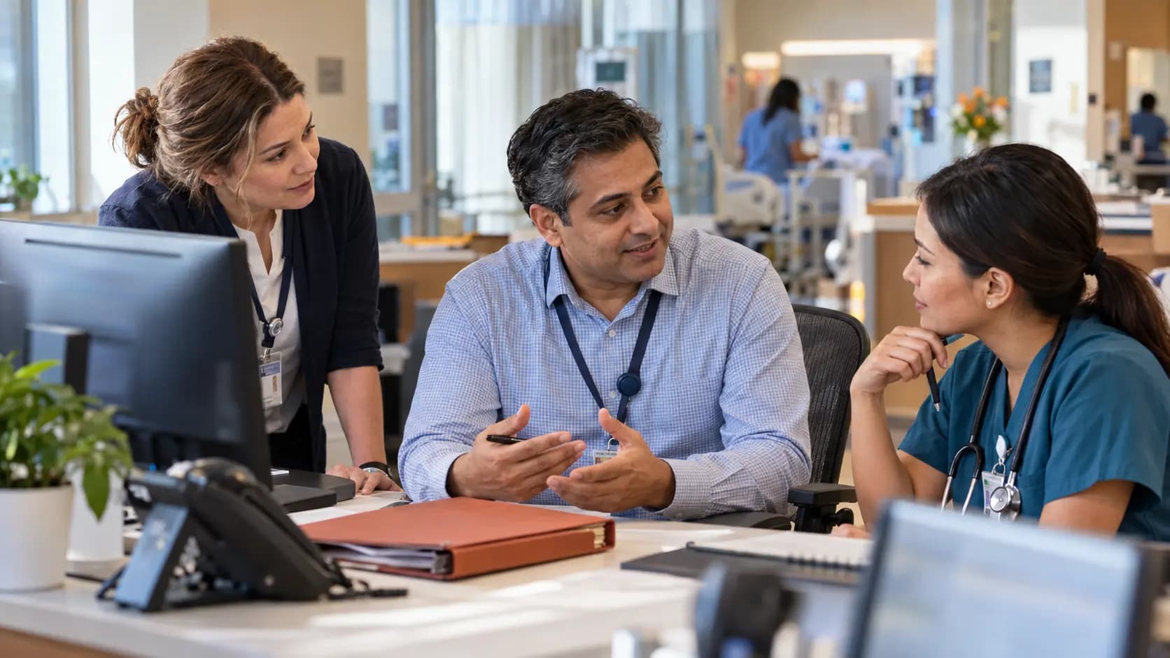 Revenue-cycle specialist and clinician resolving a billing workflow together Revenue-cycle specialist and clinician resolving a billing workflow together
