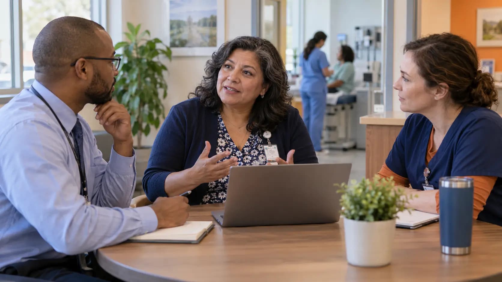 Healthcare operations and compliance colleagues collaborating in an office