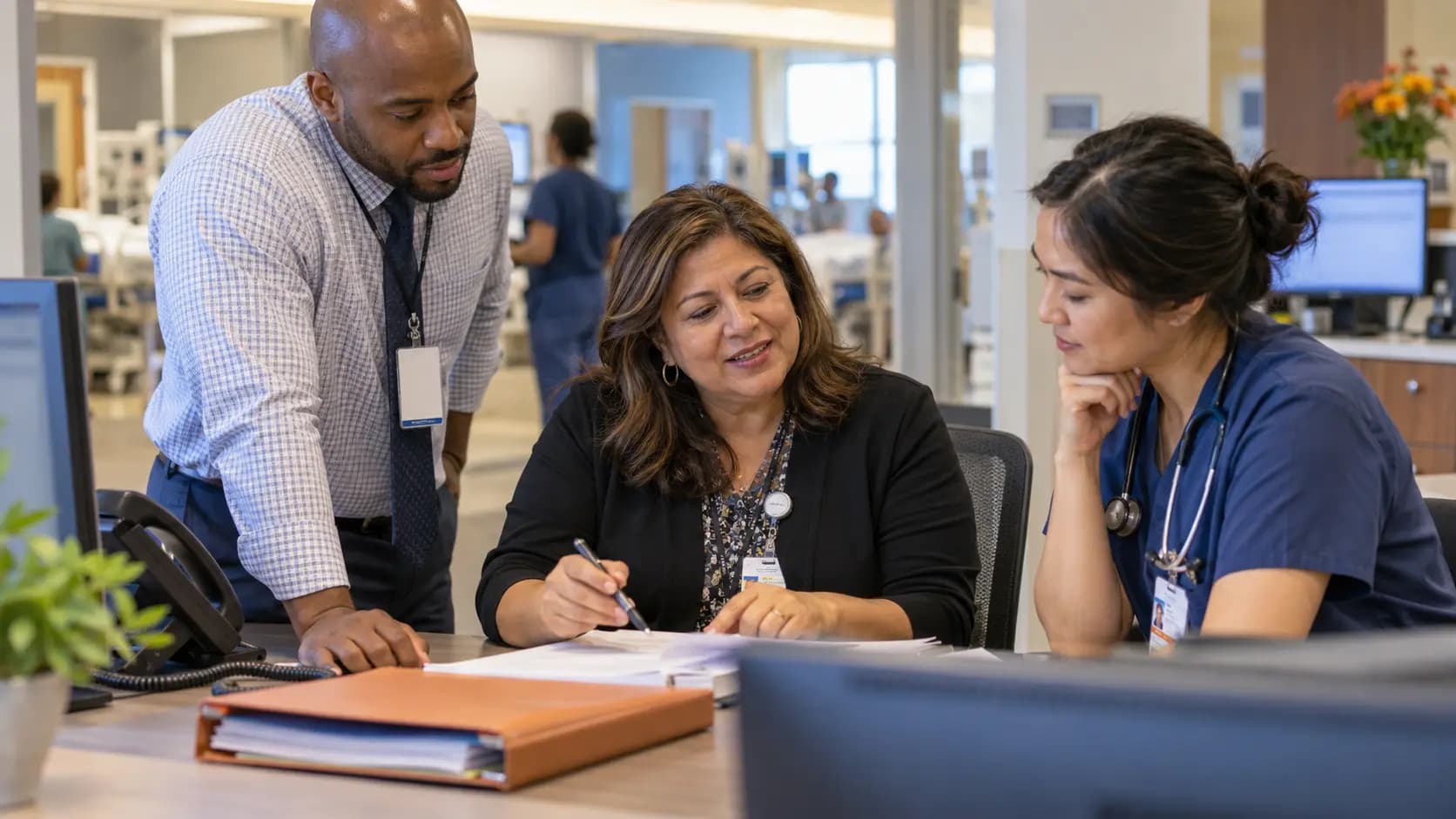 Revenue-cycle specialist and clinician resolving a billing workflow together Revenue-cycle specialist and clinician resolving a billing workflow together