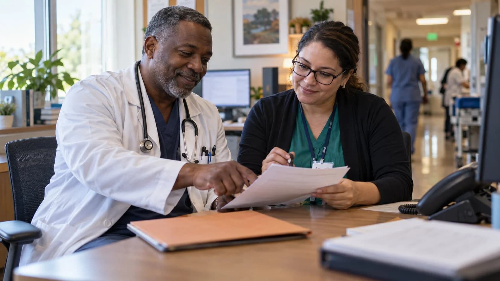 Medical coder and clinician resolving a claim detail together