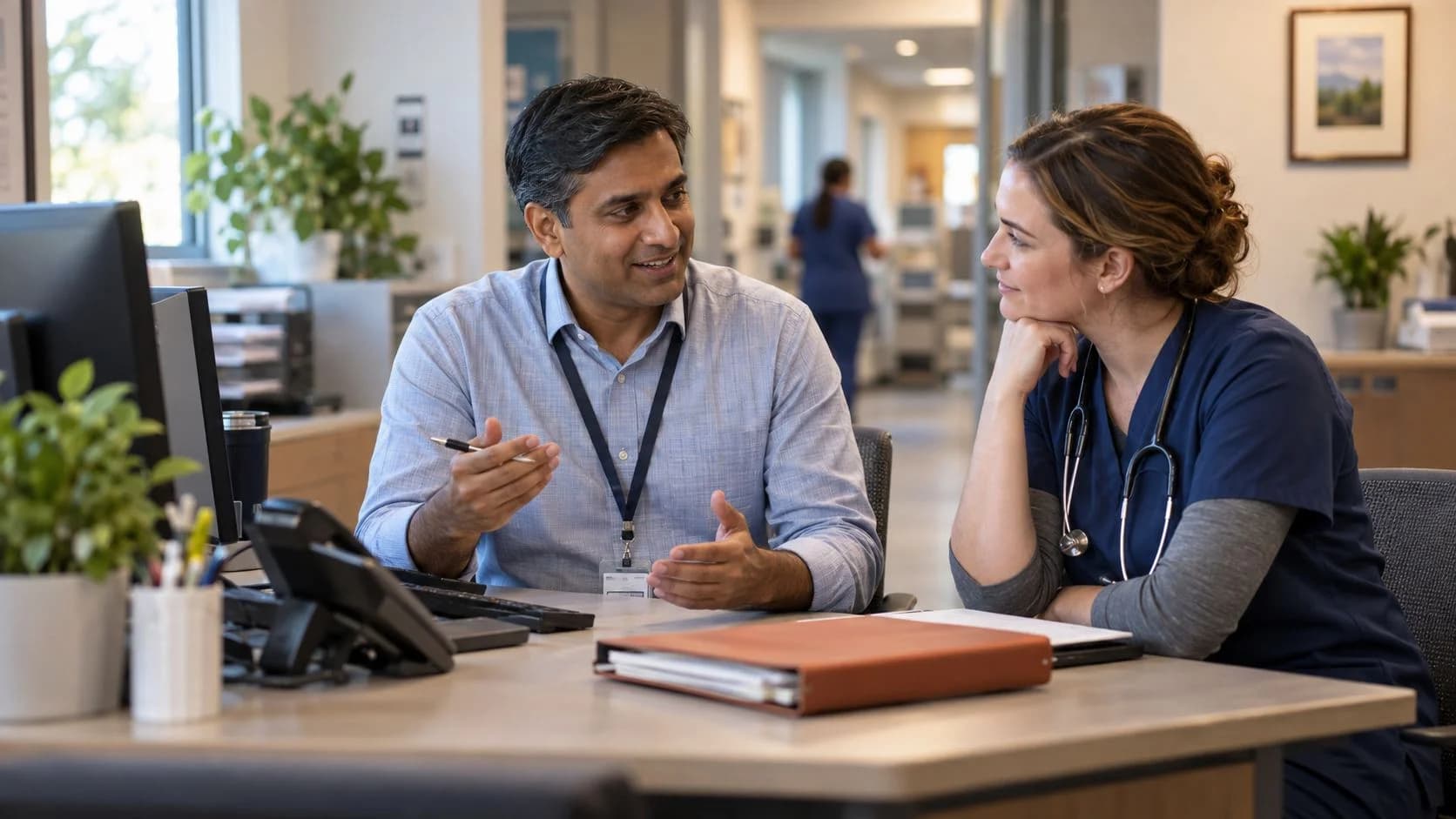 Medical coder and clinician resolving a claim detail together