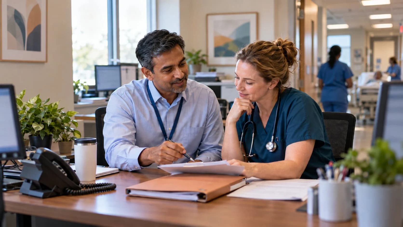 Medical coder and clinician resolving a claim detail together