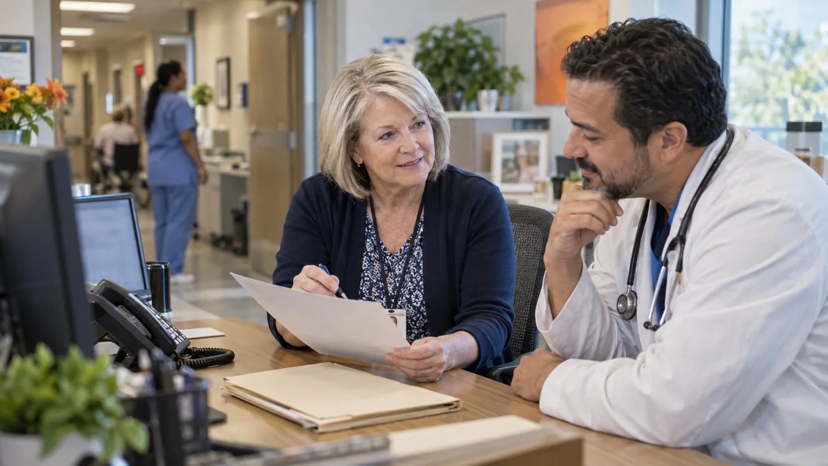 Medical coder and clinician resolving a claim detail together