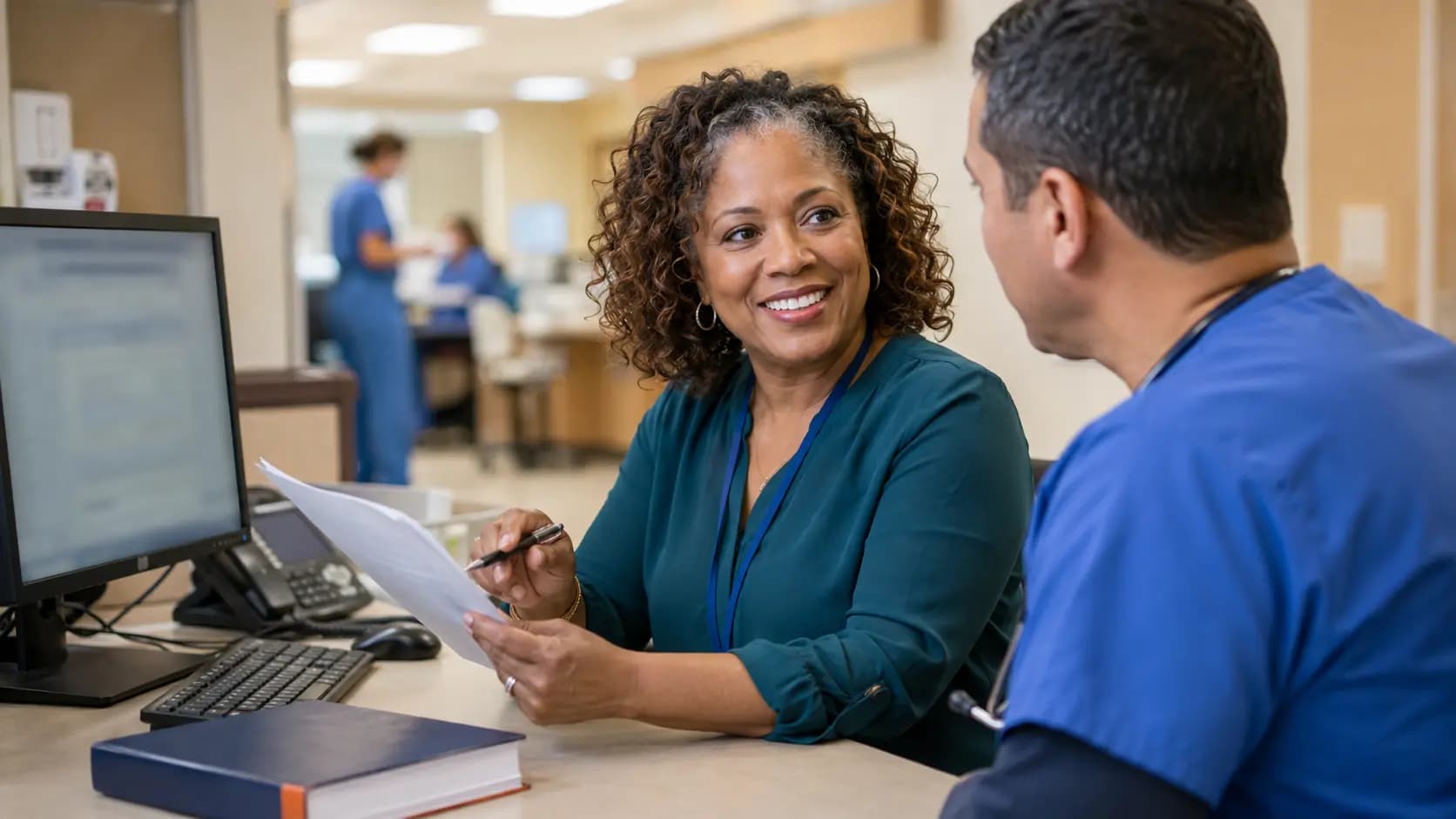 Medical coder and clinician resolving documentation together