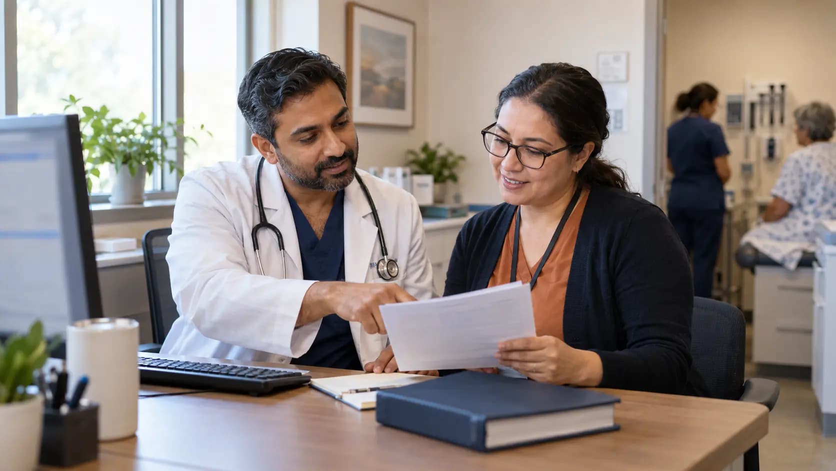 Medical coder and clinician resolving documentation together