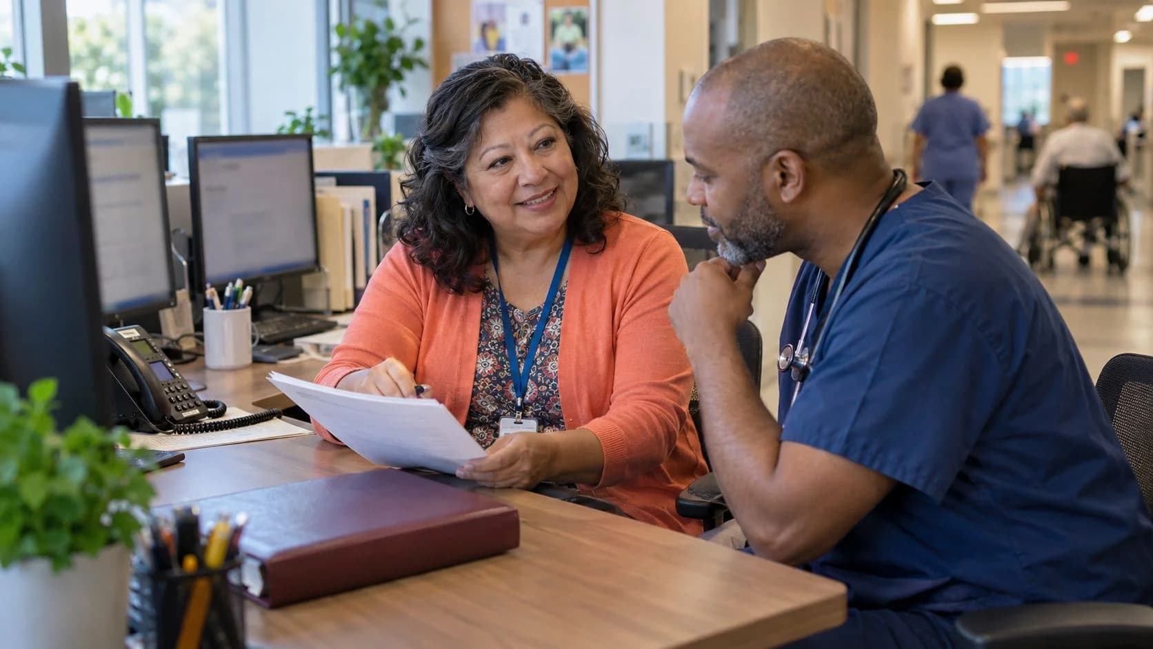 Medical coder and clinician resolving a claim detail together
