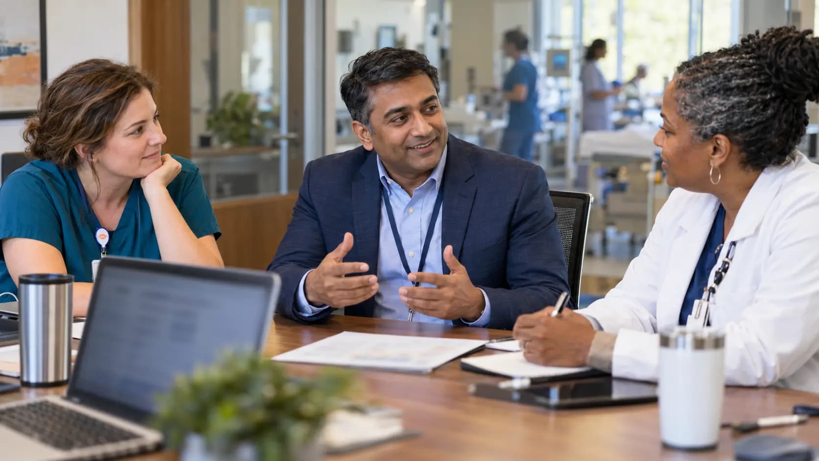 Healthcare finance and operations leaders discussing a practical next step Healthcare finance and operations leaders discussing a practical next step