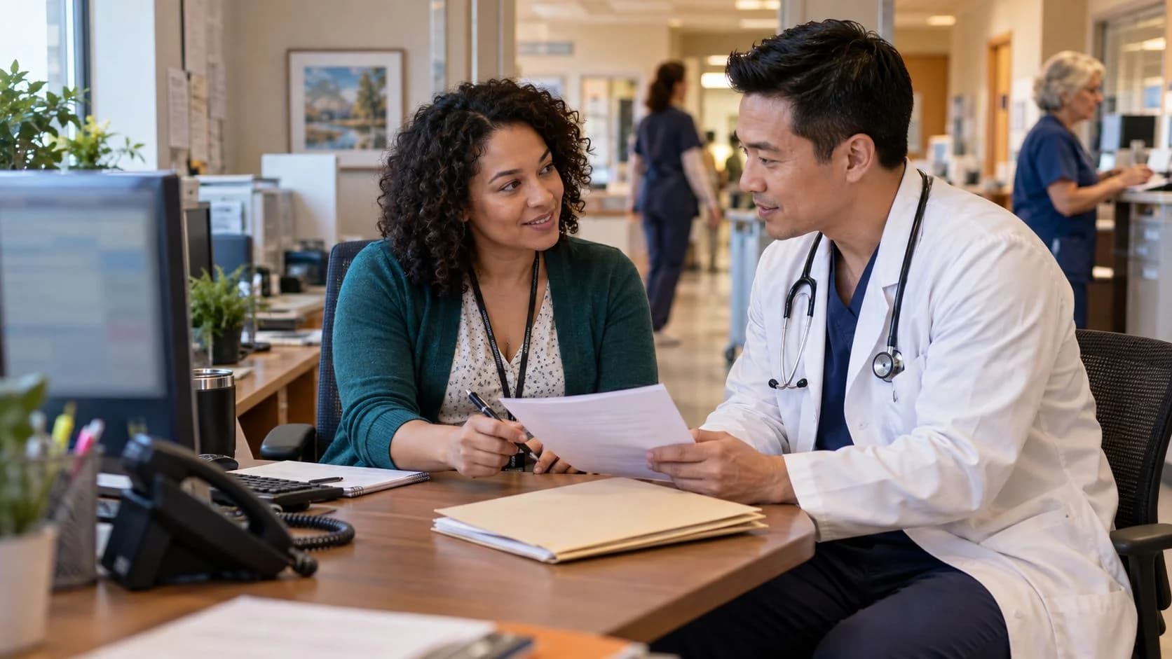 Medical coder and clinician resolving a claim detail together