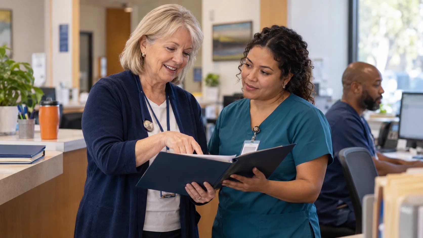 Healthcare compliance officer reviewing a safe workflow with clinic staff