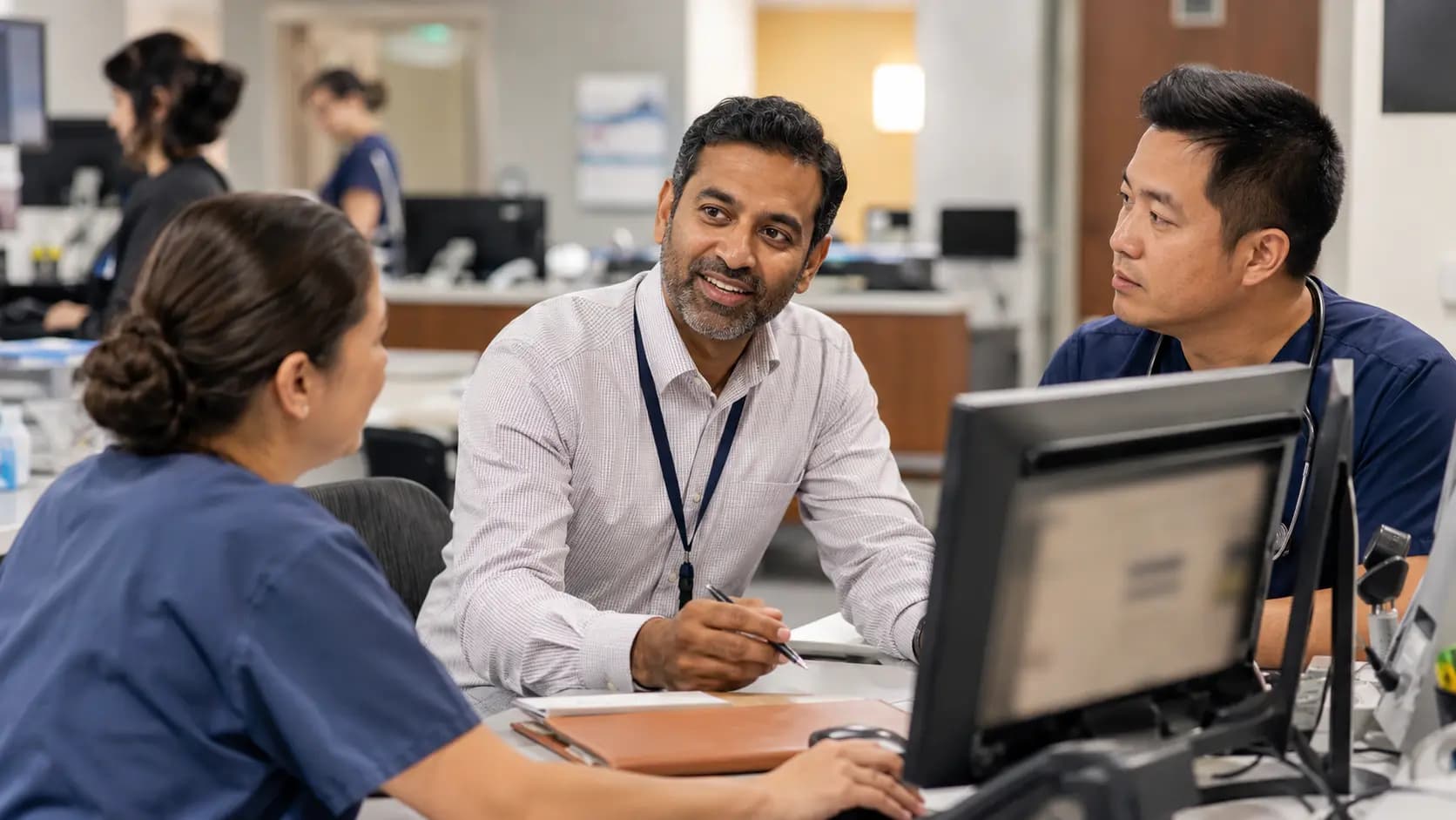 Revenue-cycle specialist and clinician resolving a billing workflow together