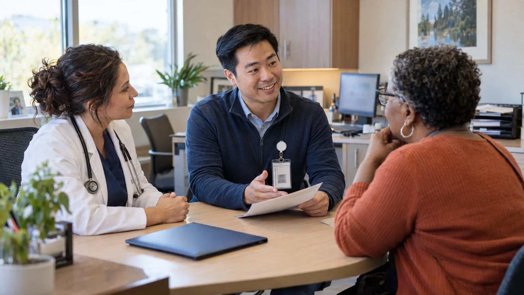 Benefits coordinator helping a clinician and patient understand coverage