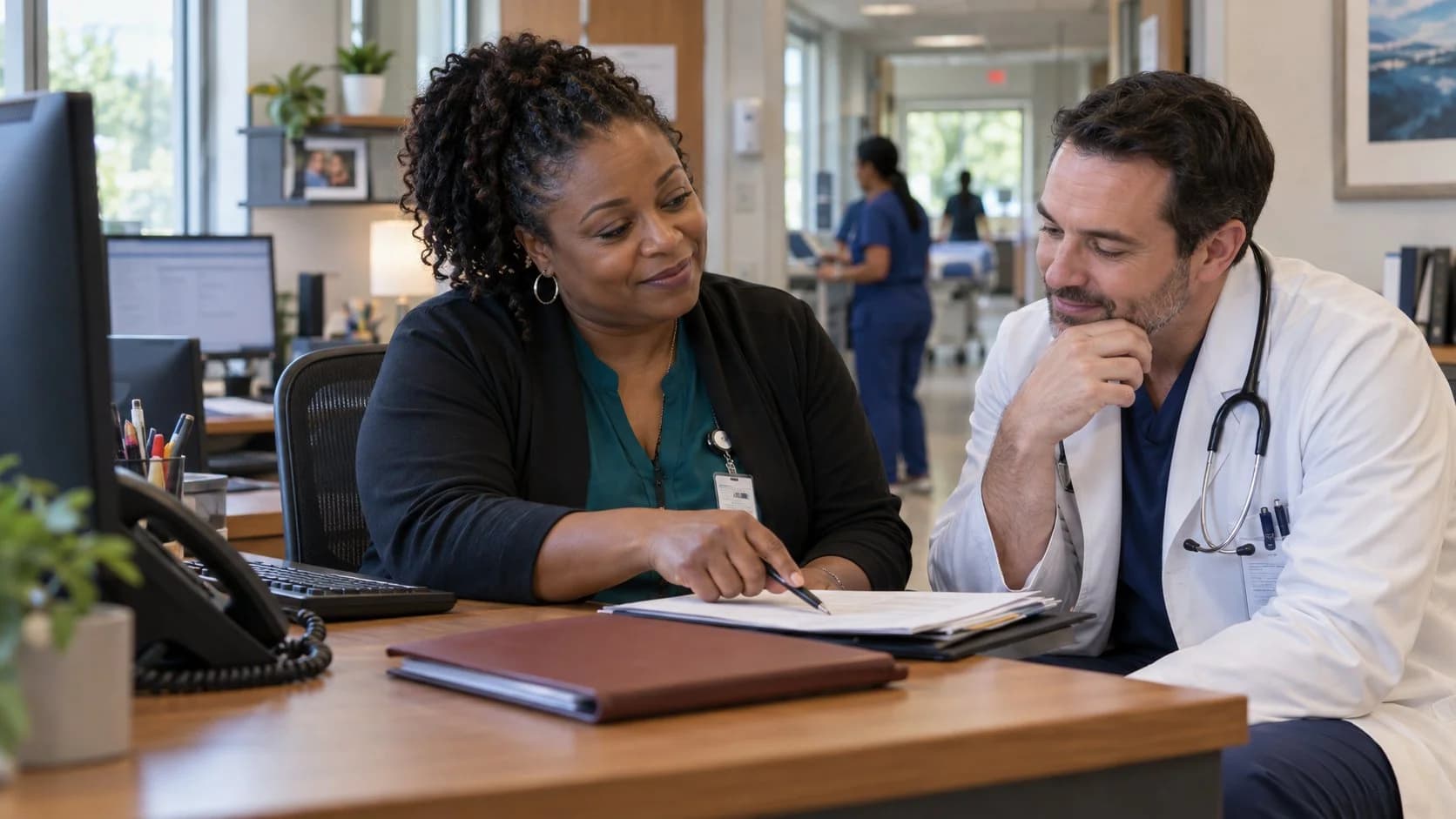 Medical coder and clinician resolving a claim detail together