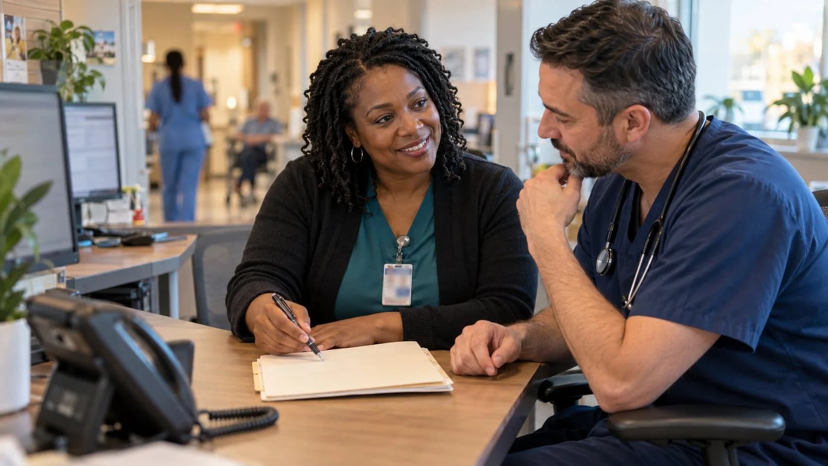 Medical coder and clinician resolving a claim detail together