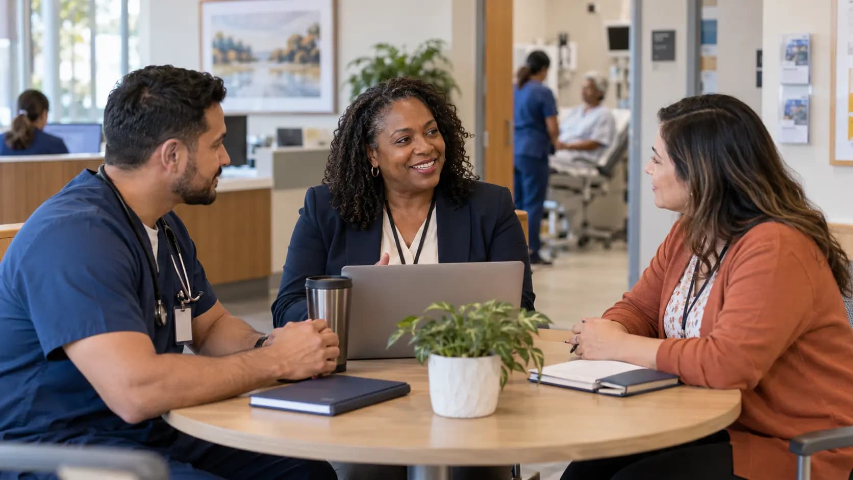 Healthcare operations and compliance colleagues collaborating in an office