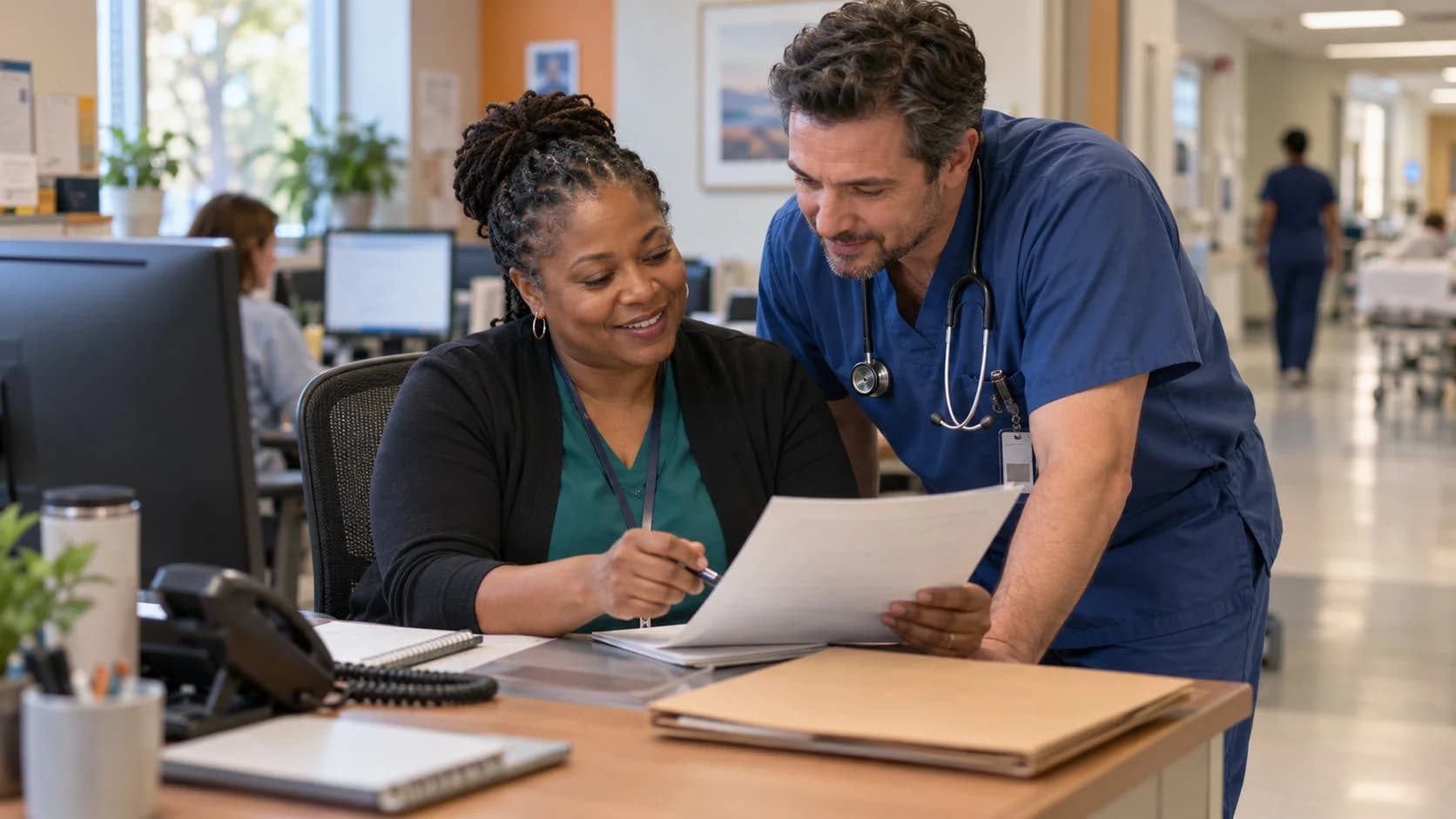 Medical coder and clinician resolving a claim detail together