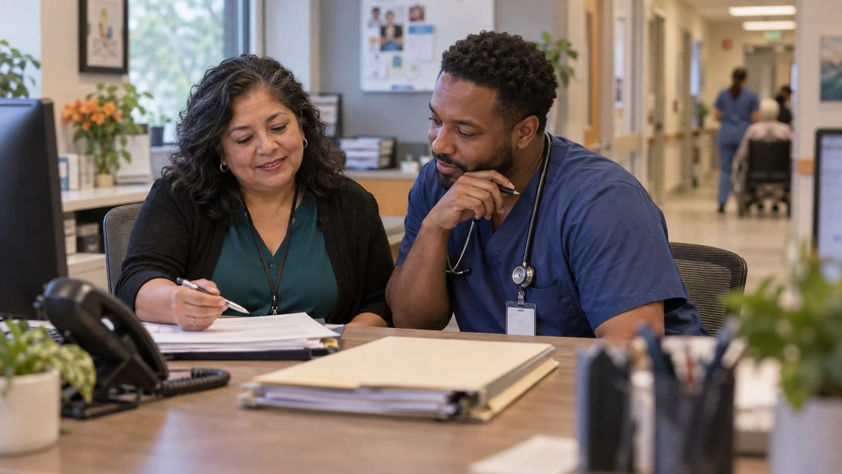 Medical coder and clinician resolving a claim detail together
