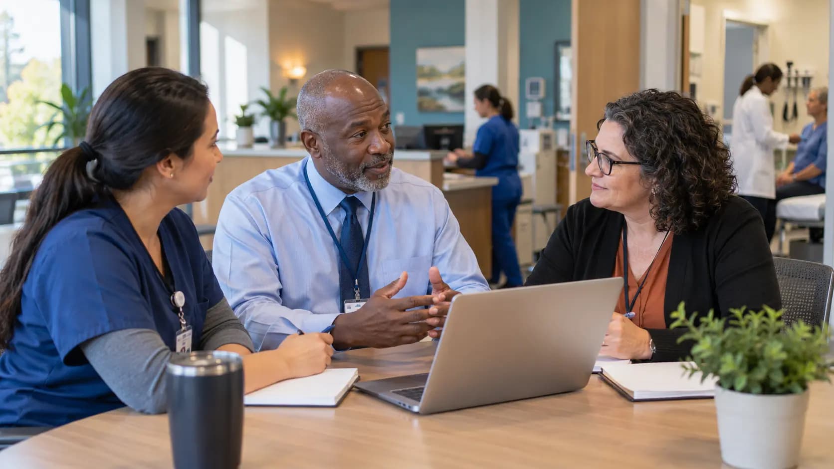 Healthcare operations and compliance colleagues collaborating in an office