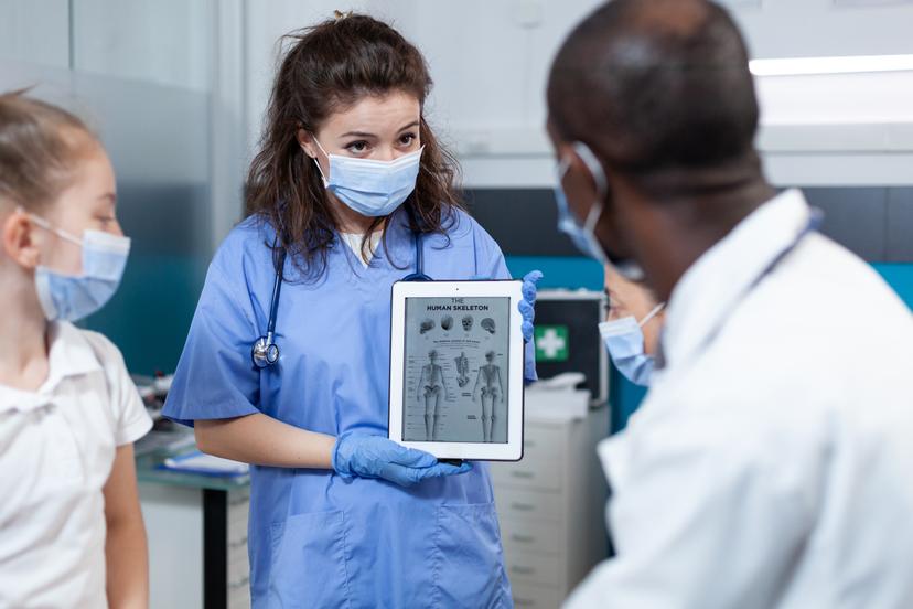 Clinician reviewing a tablet for mental health workflow integration