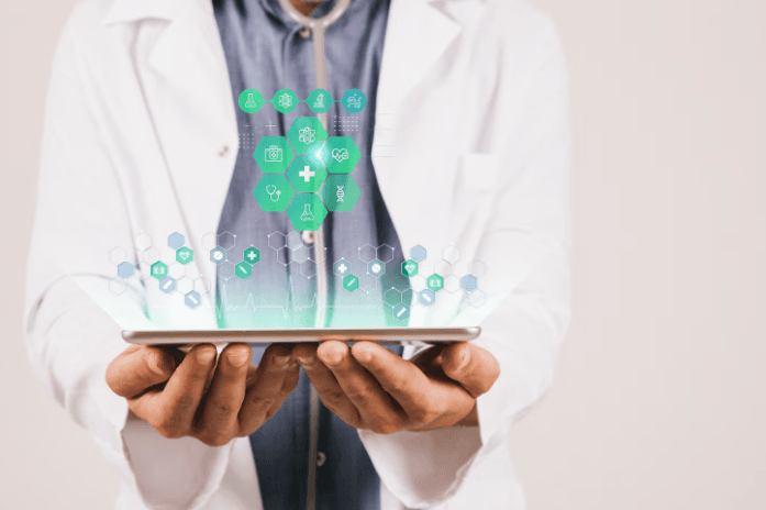 Clinician using a digital healthcare dashboard with medical icons